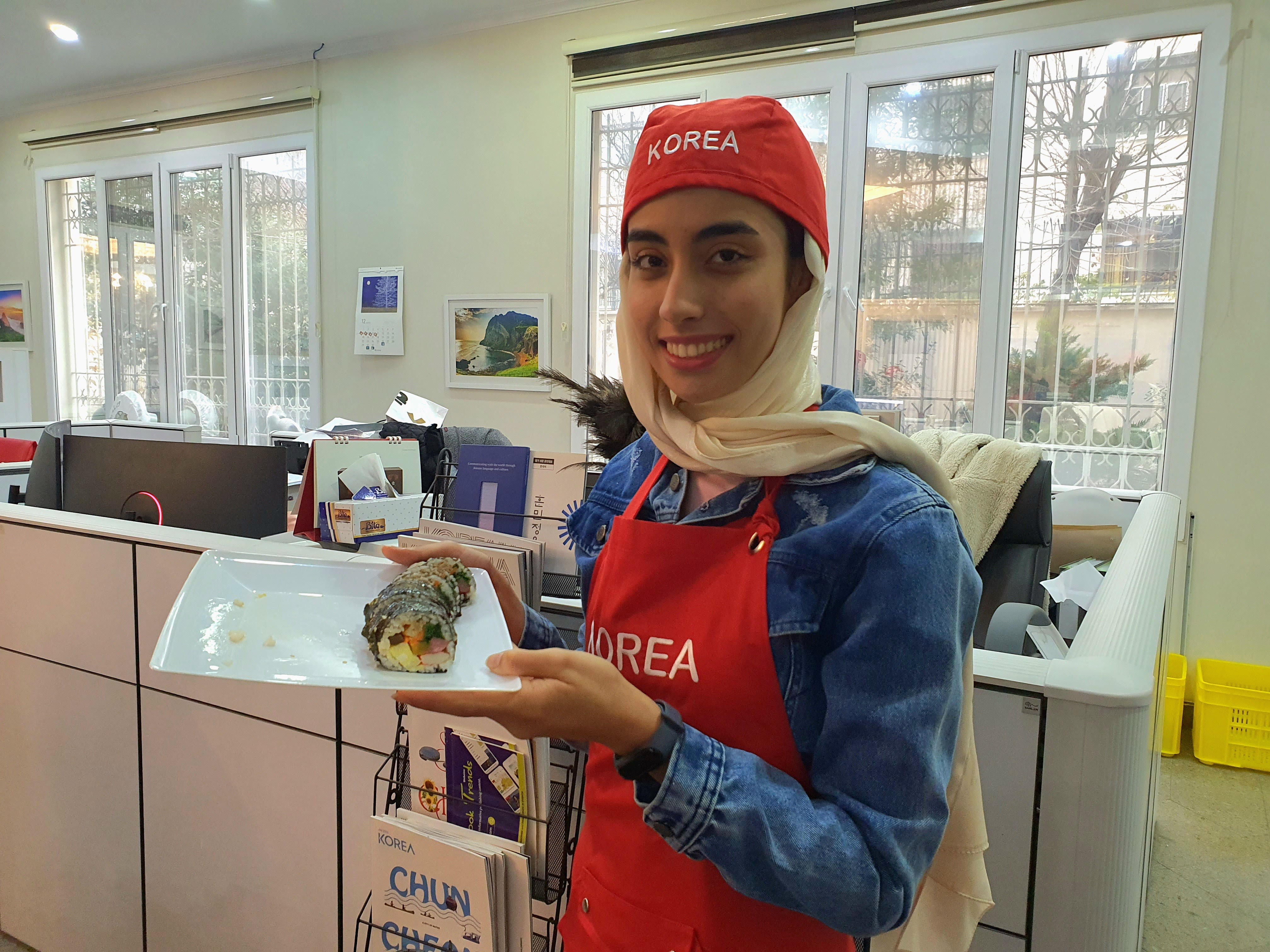 Fatemeh holding a Kimbap made by her (photo by fatemeh Rafatnia with permission)