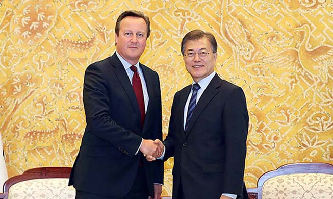 President Moon meets former British PM