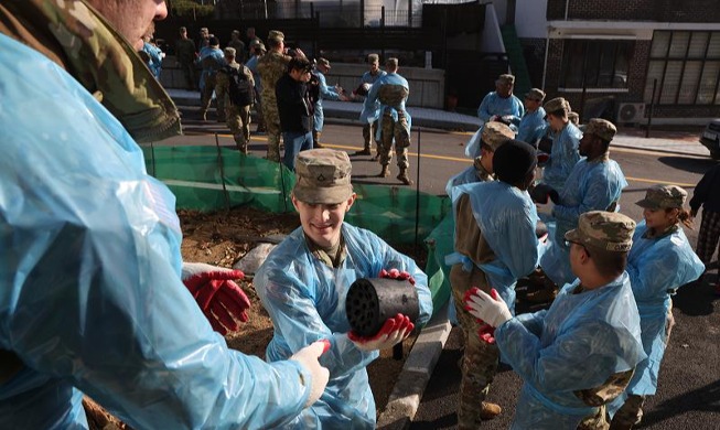 US soldiers deliver 'coal briquettes of love' to needy families