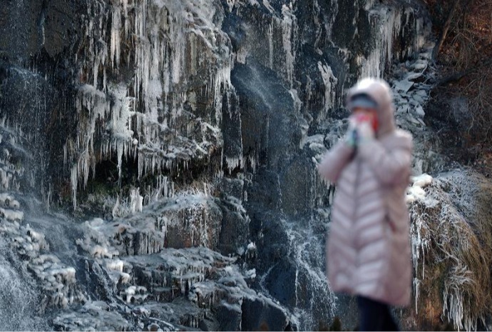 Cold wave creates icy waterfall