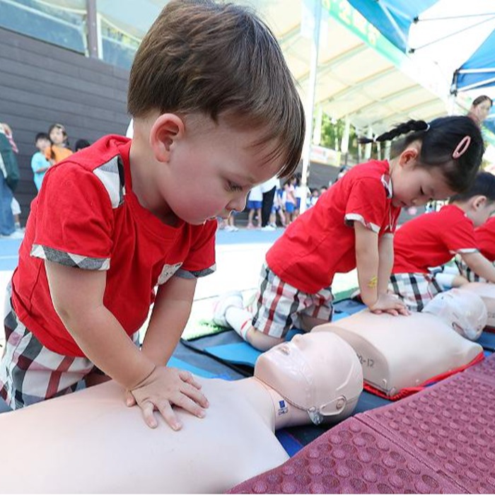 Cute little hands practicing CPR